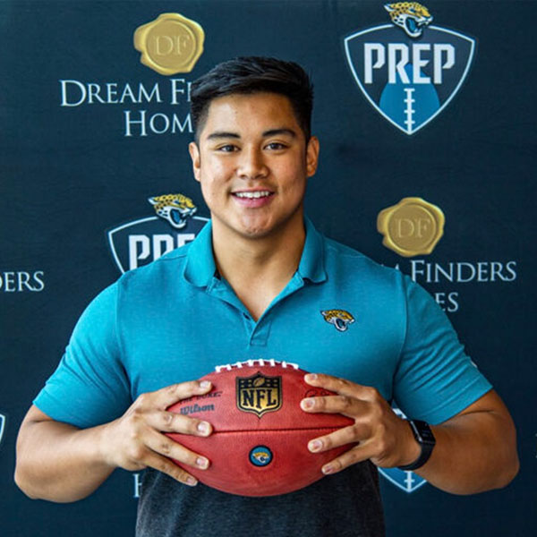 raymond holding a football
