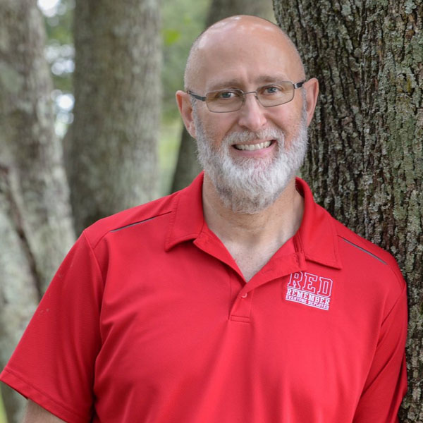robert leaning against a tree
