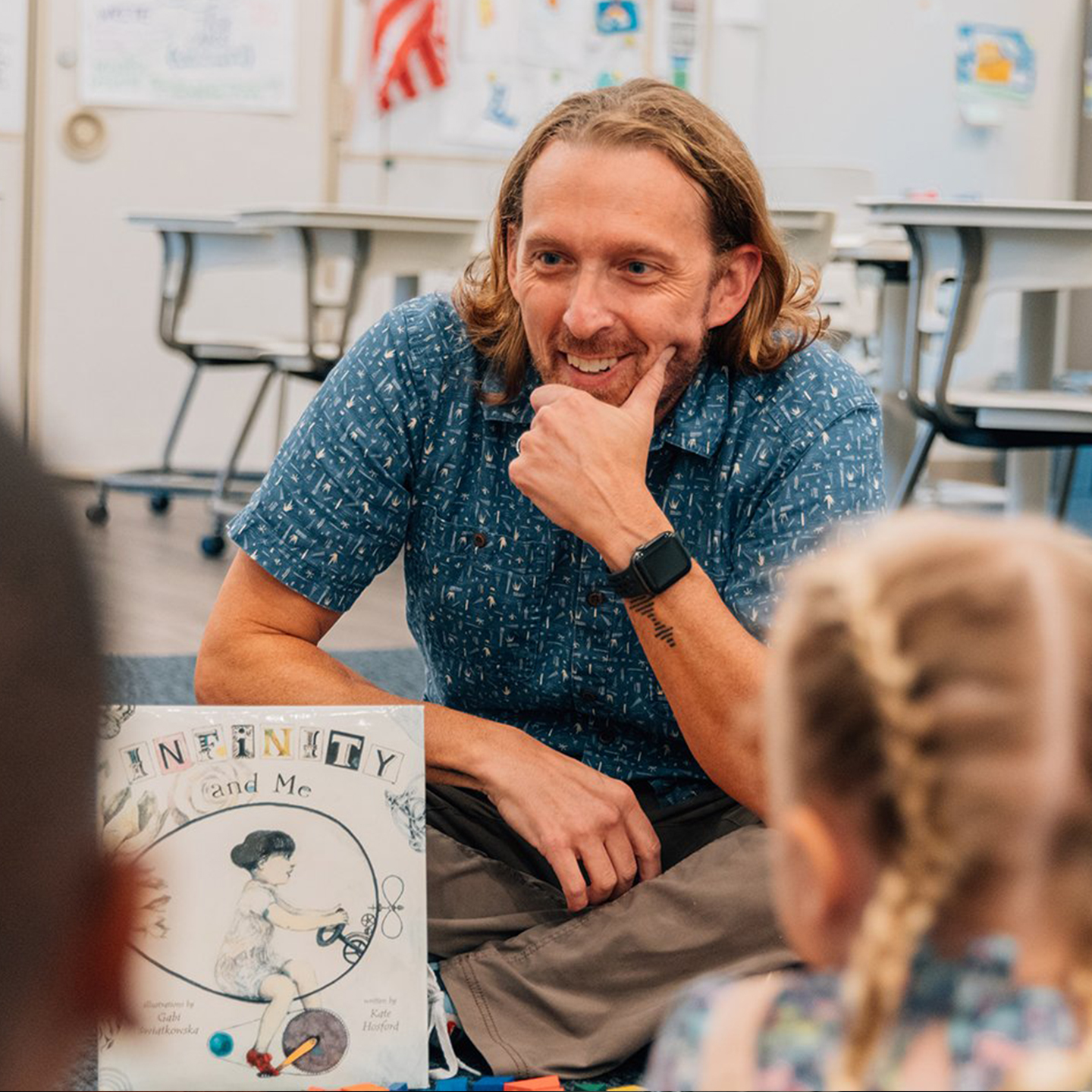 Zak Champagne teaching young students