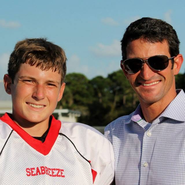 Noah and Greg Motto at football game