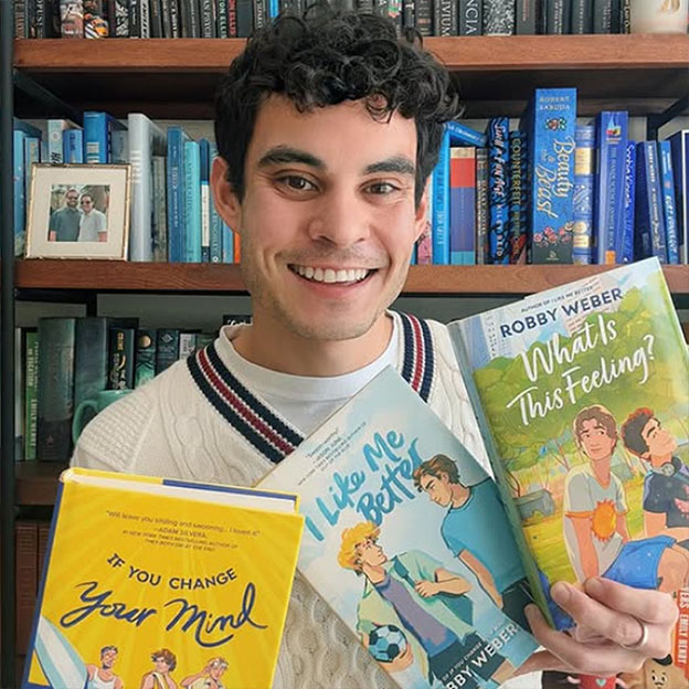 Robby holding his books