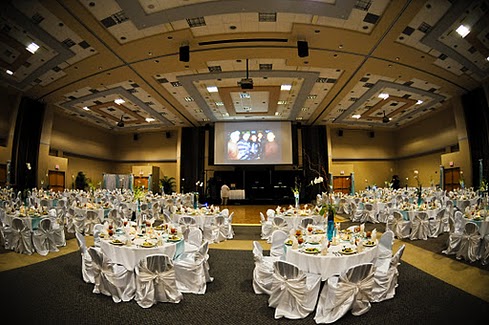 wide view of the room with formal table settings
