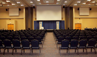 rows of chairs with stage in front