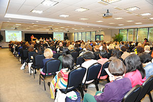 people sitting in rows at a conference