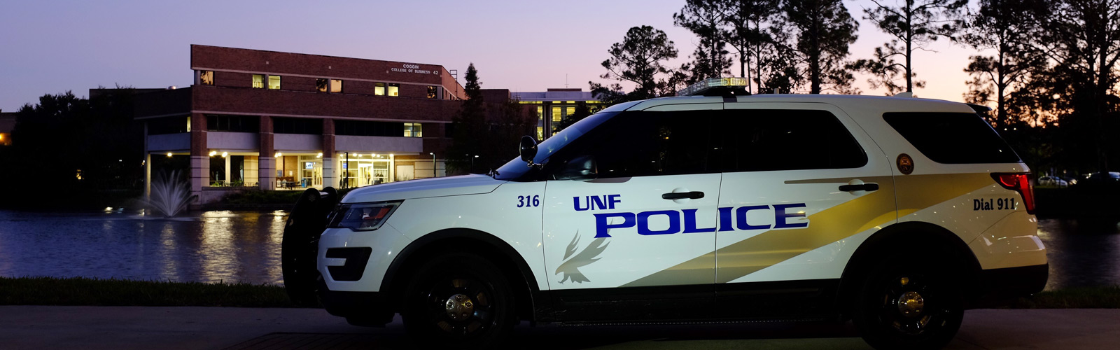 UNF Police car in front of the Coggin College of Business