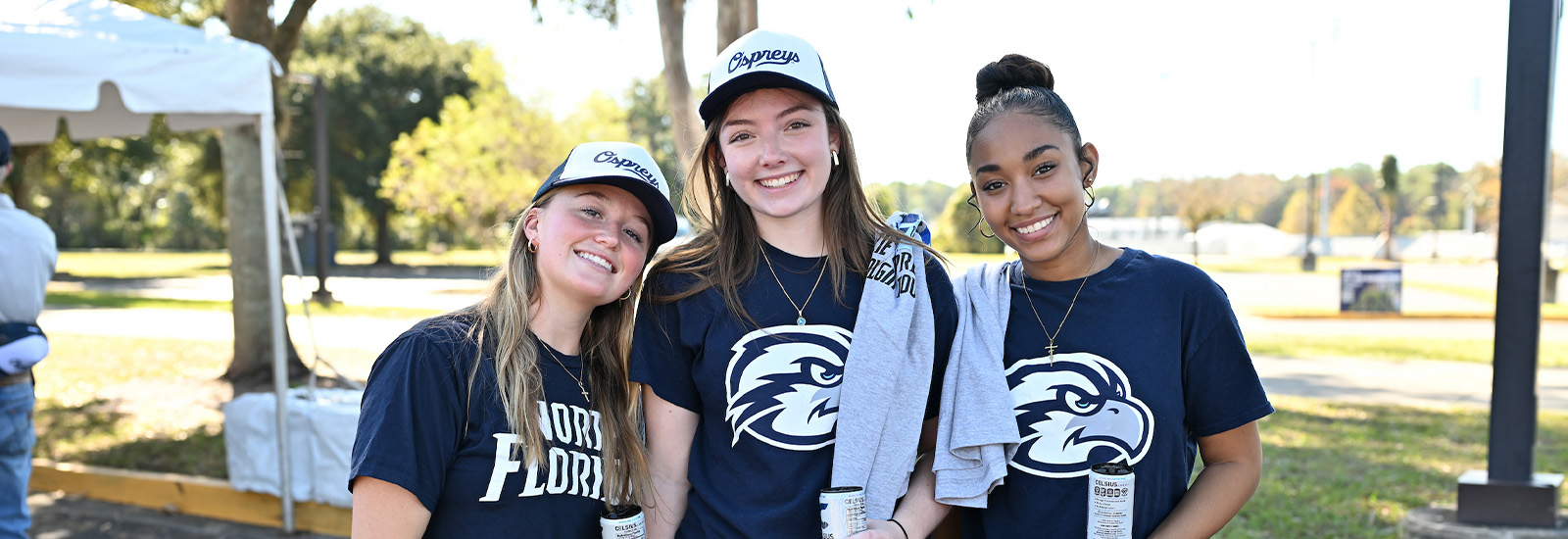 A picture of three women wearing UNF attire
